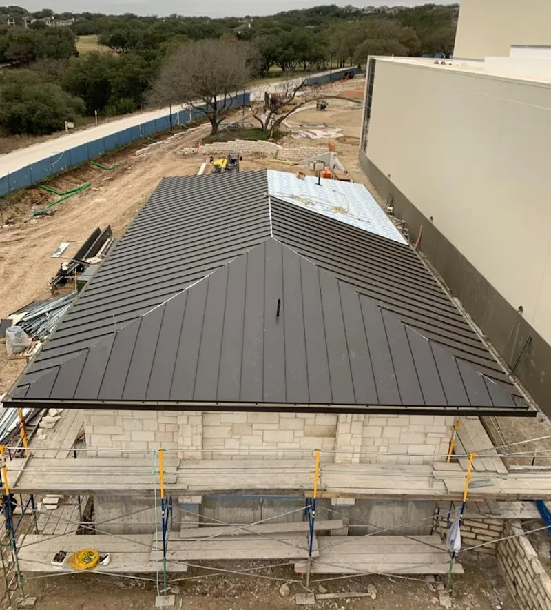 Metal roof new construction with scaffolding in Greenbriar